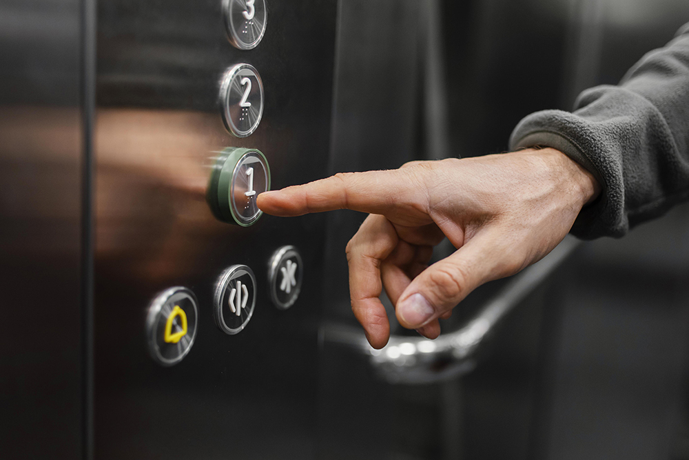 delivery man with package elevator close up.jpg